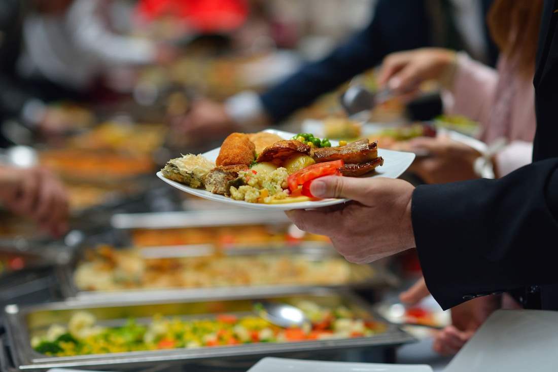 Catering table arrangement with guests