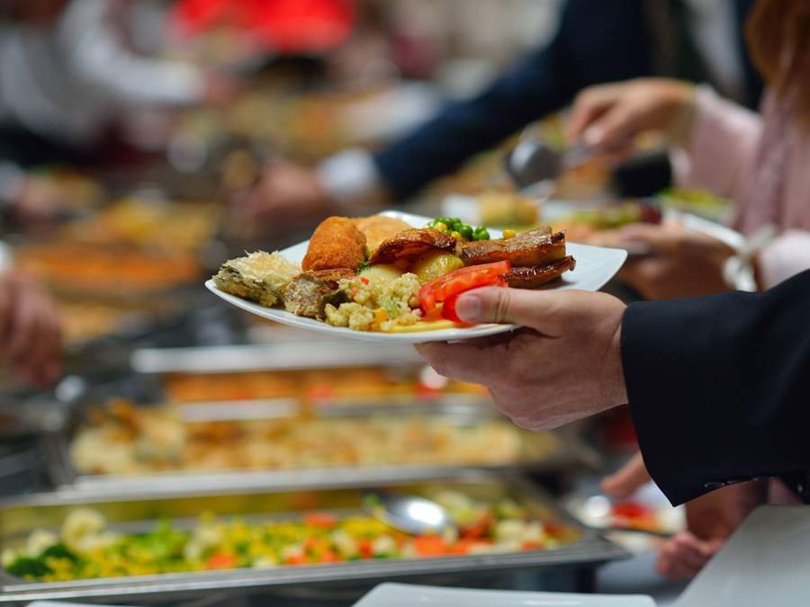 Catering table arrangement with guests